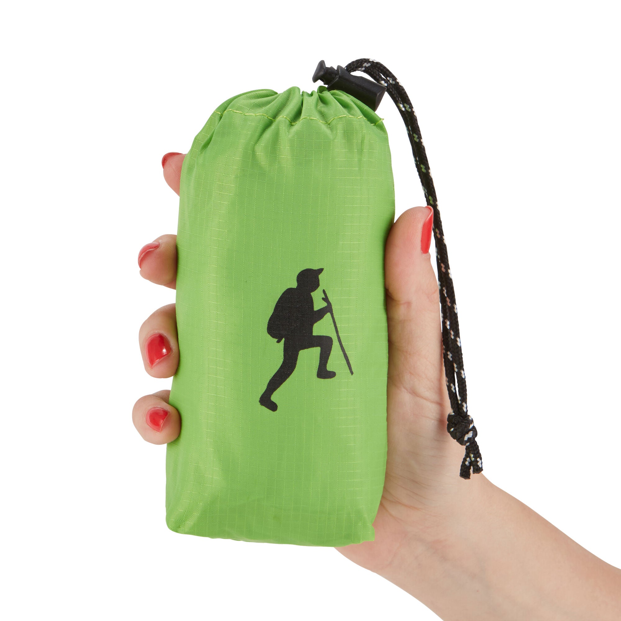 A hand holding a small, black HIKE Back- Folding Backpack with a white hiker icon printed on it, isolated against a white background.
