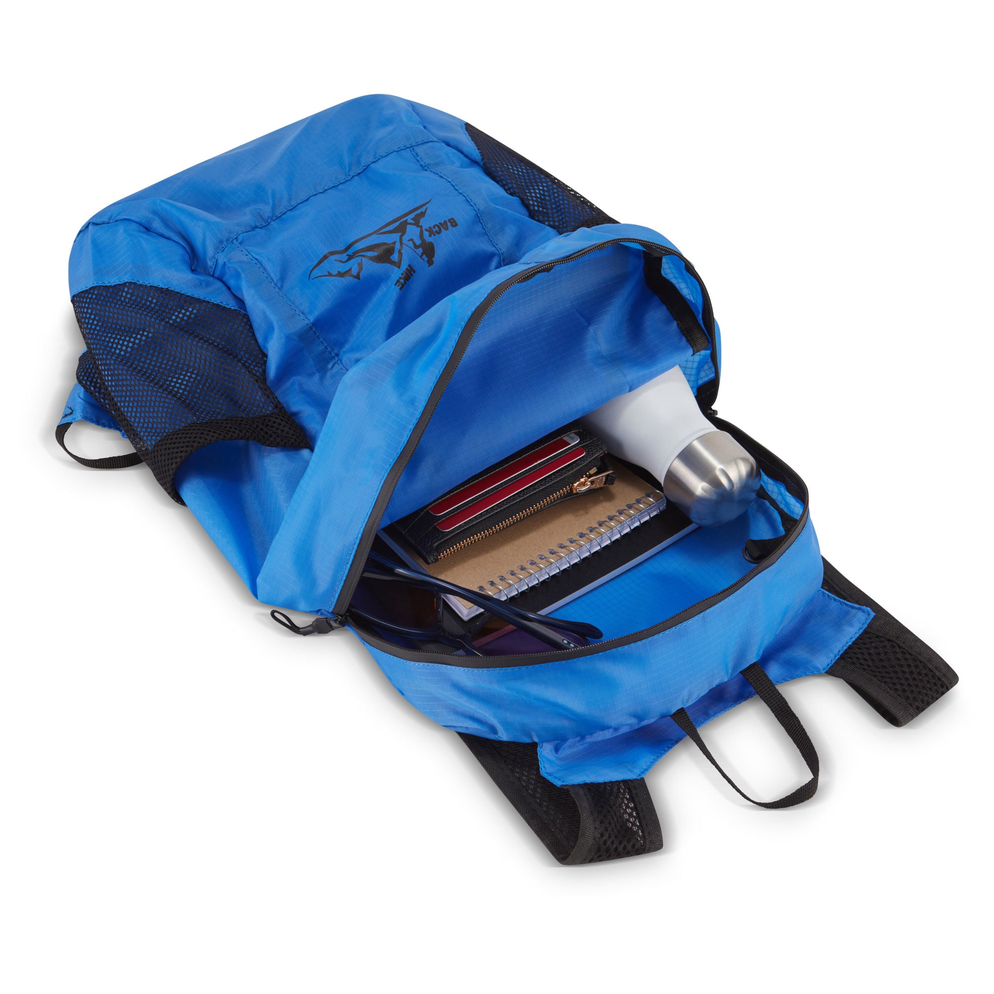 A hand holding a small, black HIKE Back- Folding Backpack with a white hiker icon printed on it, isolated against a white background.