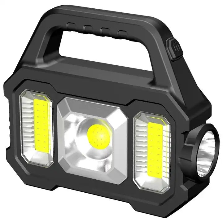 A hand holding a 2N1 Solar COB Work Light featuring a central spotlight and two side lights.