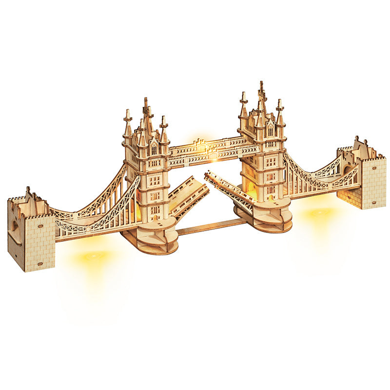 A Robotime Rolife DIY 3D Tower Bridge Famous Building Wooden Puzzle Game Assembly Toy Gift for Children Teen Adult with opened drawbridge, illuminated from below, displayed on a plain background.