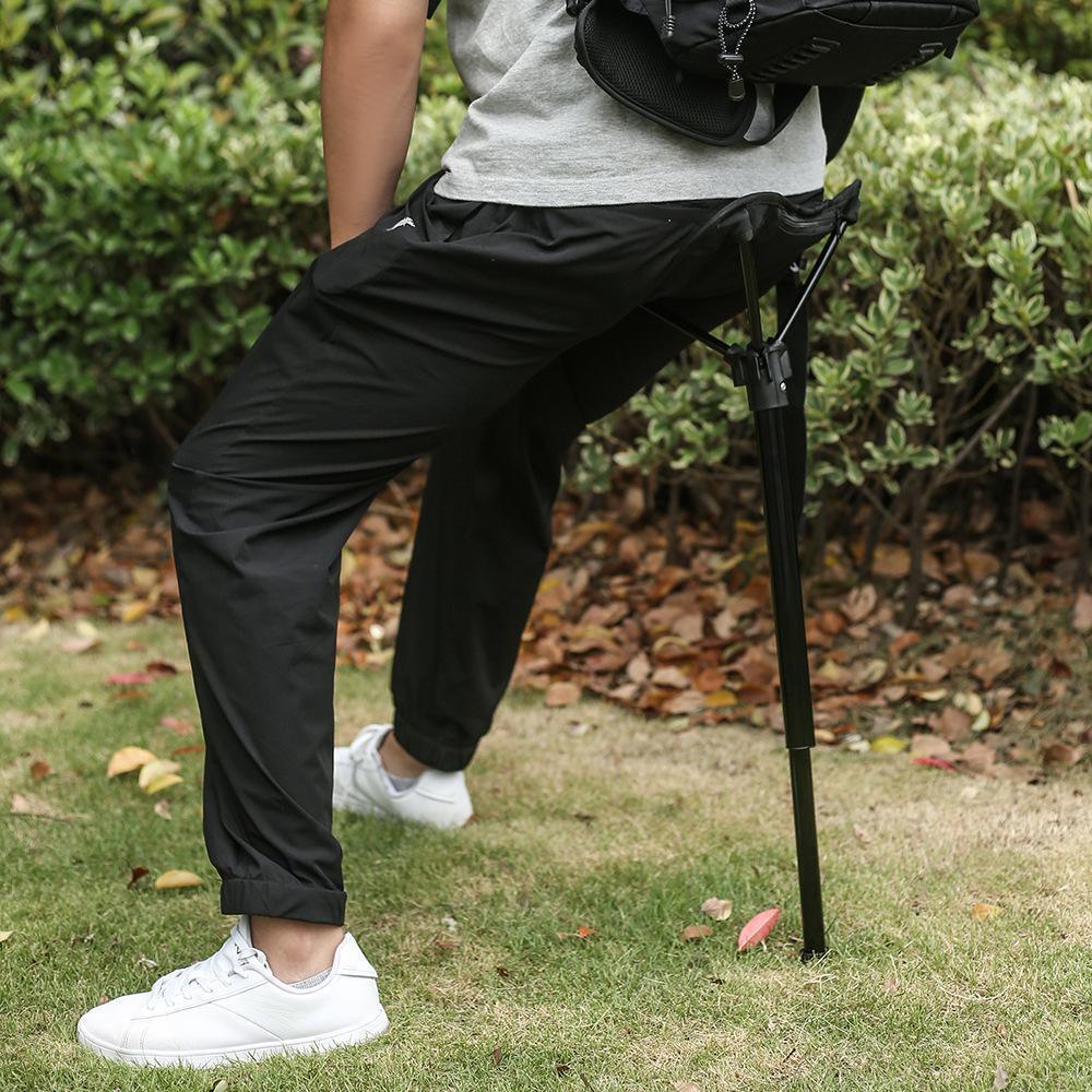 Outdoor Portable Retractable Stool Fishing Summer Hiking Chair Travel Fordable Stool with a triangular seat and a portable tripod base.