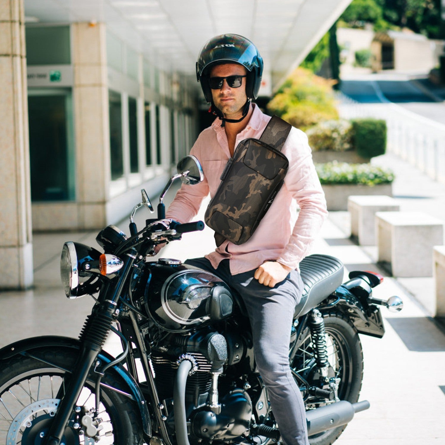 A Men's Sling Backpack Waterproof Anti-theft Shoulder Crossbody Chest Bag Messenger Sling Bag Daypack with USB Charging Port, featuring a smooth outer surface and an adjustable shoulder strap, isolated on a white background.