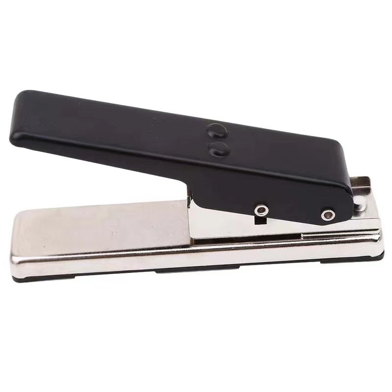 A hand using a Guitar Picks Maker to create personalized guitar picks from a credit card, showing a resulting pick and a leftover piece.