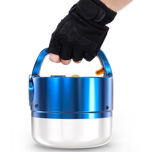 A blue 3N1 Solar Lantern With Remote hanging from a tree branch in a forest setting, ideal for outdoor adventures.