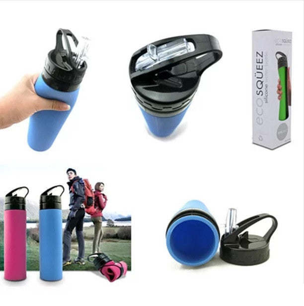 Four SILLYMATE Silicon Squeeze N Sip Waterbottles in pink, blue, green, and white, each with a black flip-top lid, lined up on a reflective surface.