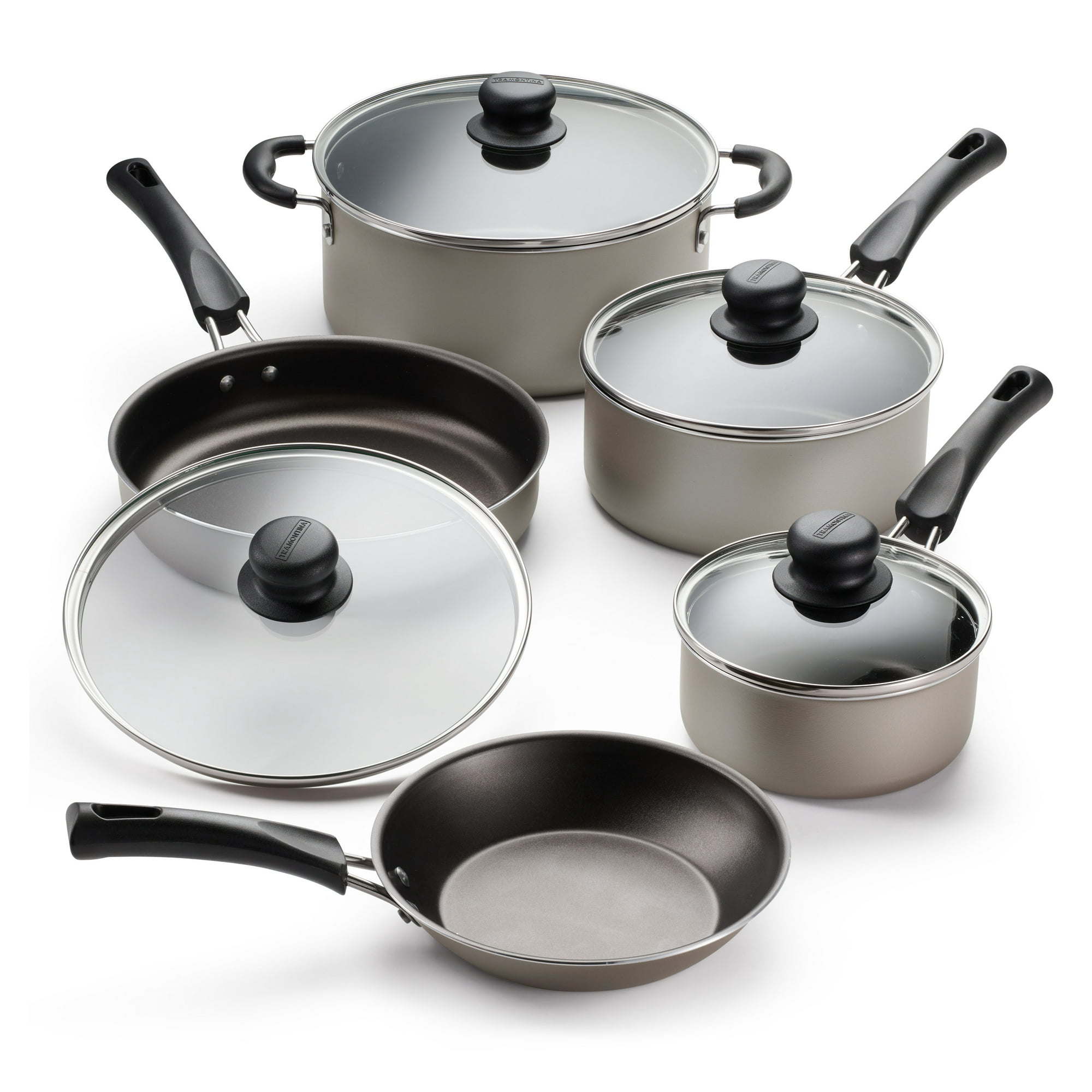 A set of new 9-Piece Non-Stick Cookware Set including two pots, a saucepan, and two frying pans, all with tempered glass lids and black handles, arranged on a white background.