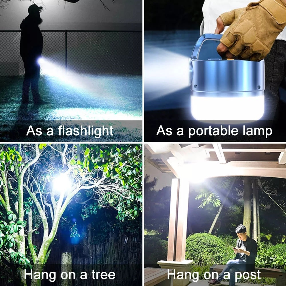 A blue 3N1 Solar Lantern With Remote hanging from a tree branch in a forest setting, ideal for outdoor adventures.