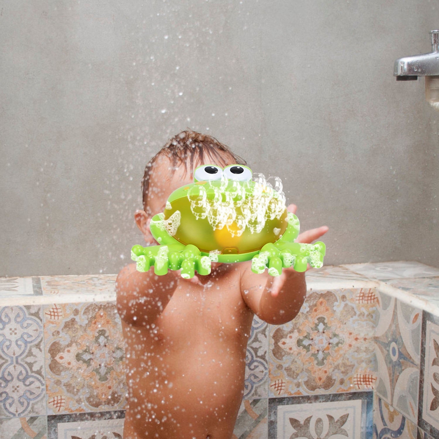 A whimsical Frog Musical Bubble Bath Maker releasing soap foam, isolated on a white background.