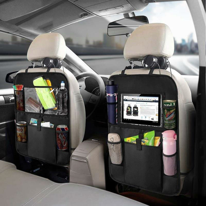 Two Backseat Car Organizers - 2PK, equipped with tablet holders and filled with items like bottles, snacks, and electronics, installed in a vehicle.