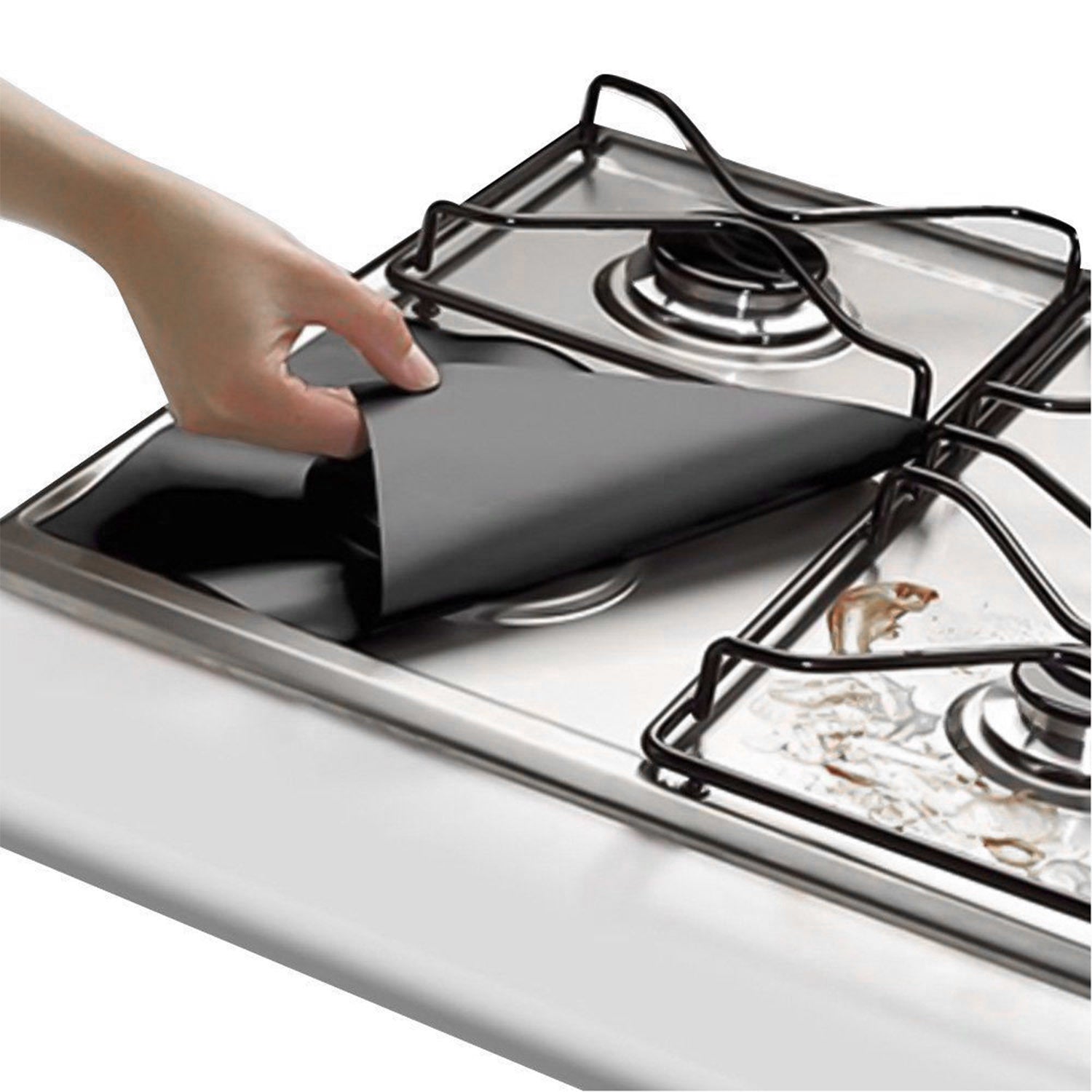 A stack of 4-Pack Reusable Nonstick Stovetop Burner Protector Liner papers with a white circle and crossing lines symbol in the center of the top sheet, treated with a PTFE coating.
