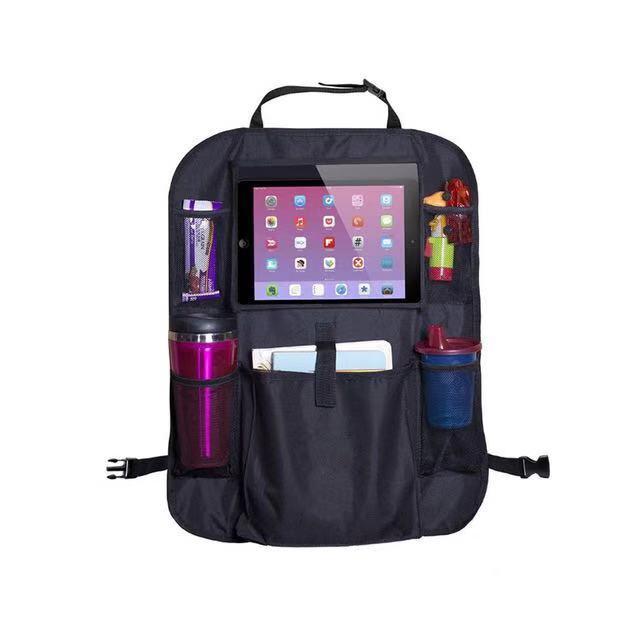 Two Backseat Car Organizers - 2PK, equipped with tablet holders and filled with items like bottles, snacks, and electronics, installed in a vehicle.