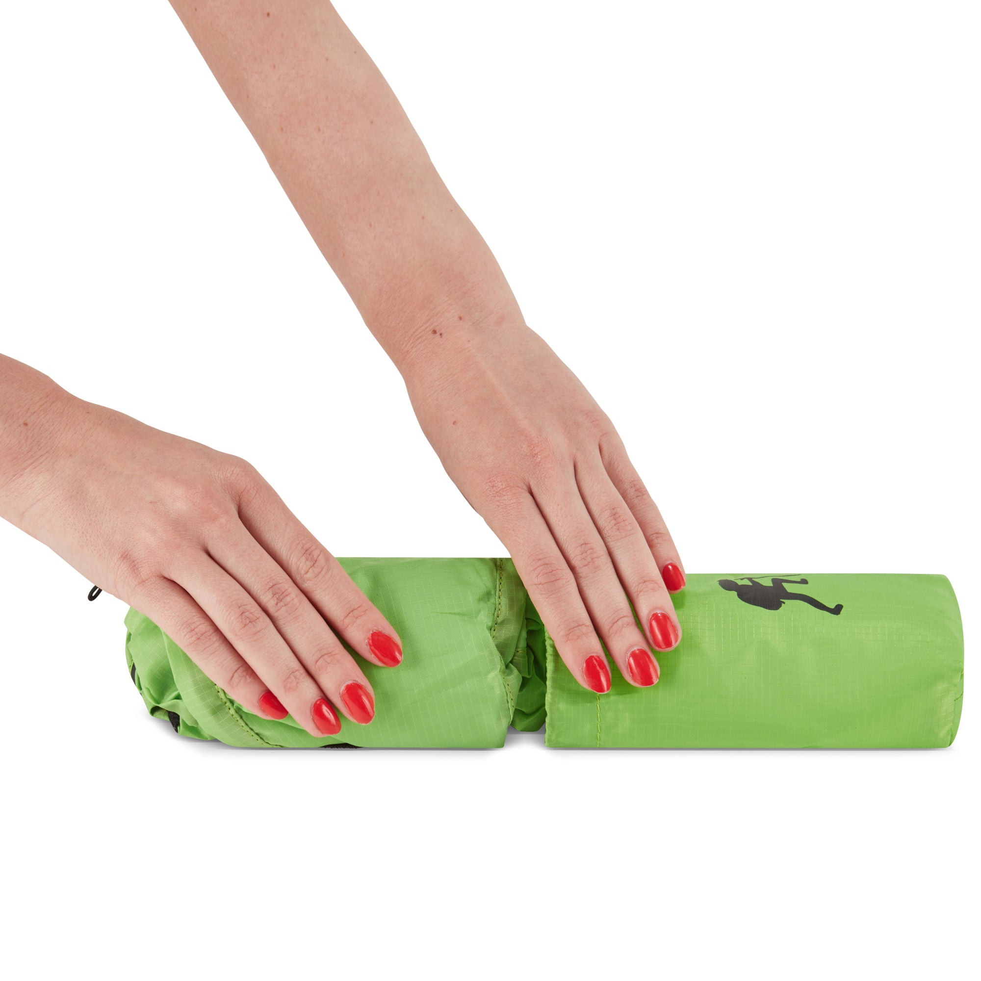 A hand holding a small, black HIKE Back- Folding Backpack with a white hiker icon printed on it, isolated against a white background.