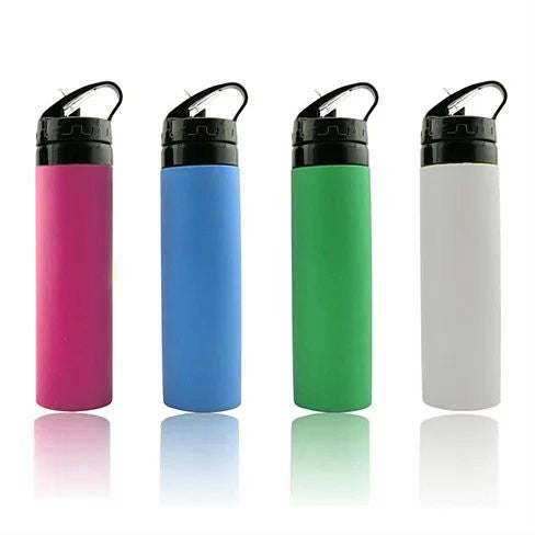 Four SILLYMATE Silicon Squeeze N Sip Waterbottles in pink, blue, green, and white, each with a black flip-top lid, lined up on a reflective surface.