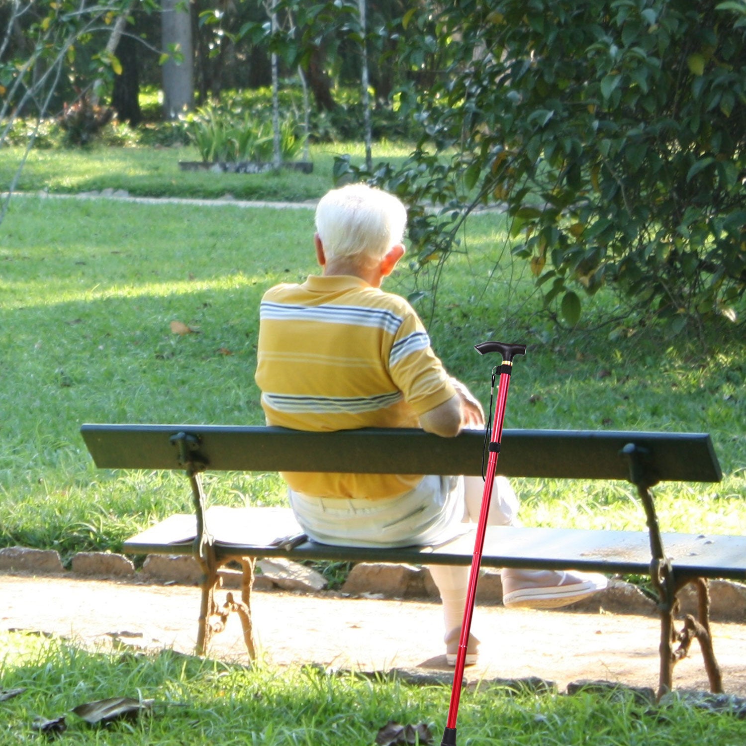 Red Walking Cane Aluminum Alloy Walking Stick Adjustable Folding Travel Hiking Stick extended and folded, isolated on a white background.