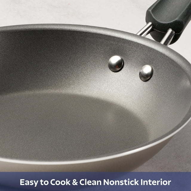 A set of new 9-Piece Non-Stick Cookware Set including two pots, a saucepan, and two frying pans, all with tempered glass lids and black handles, arranged on a white background.