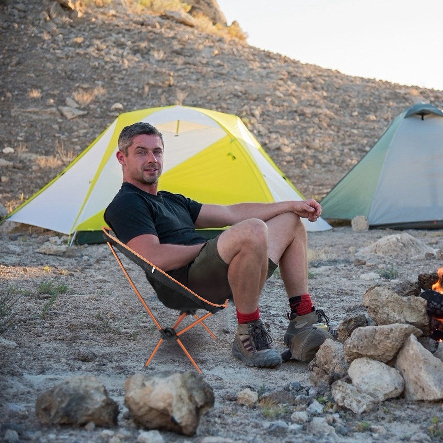 A lightweight and black Foldable Camping Chair Collapsible Ultra-light Camping Chair Backpacking Chair for Outdoor Camping Fishing BBQ Beach Picnic with a mesh backrest and storage pouches on a white background.