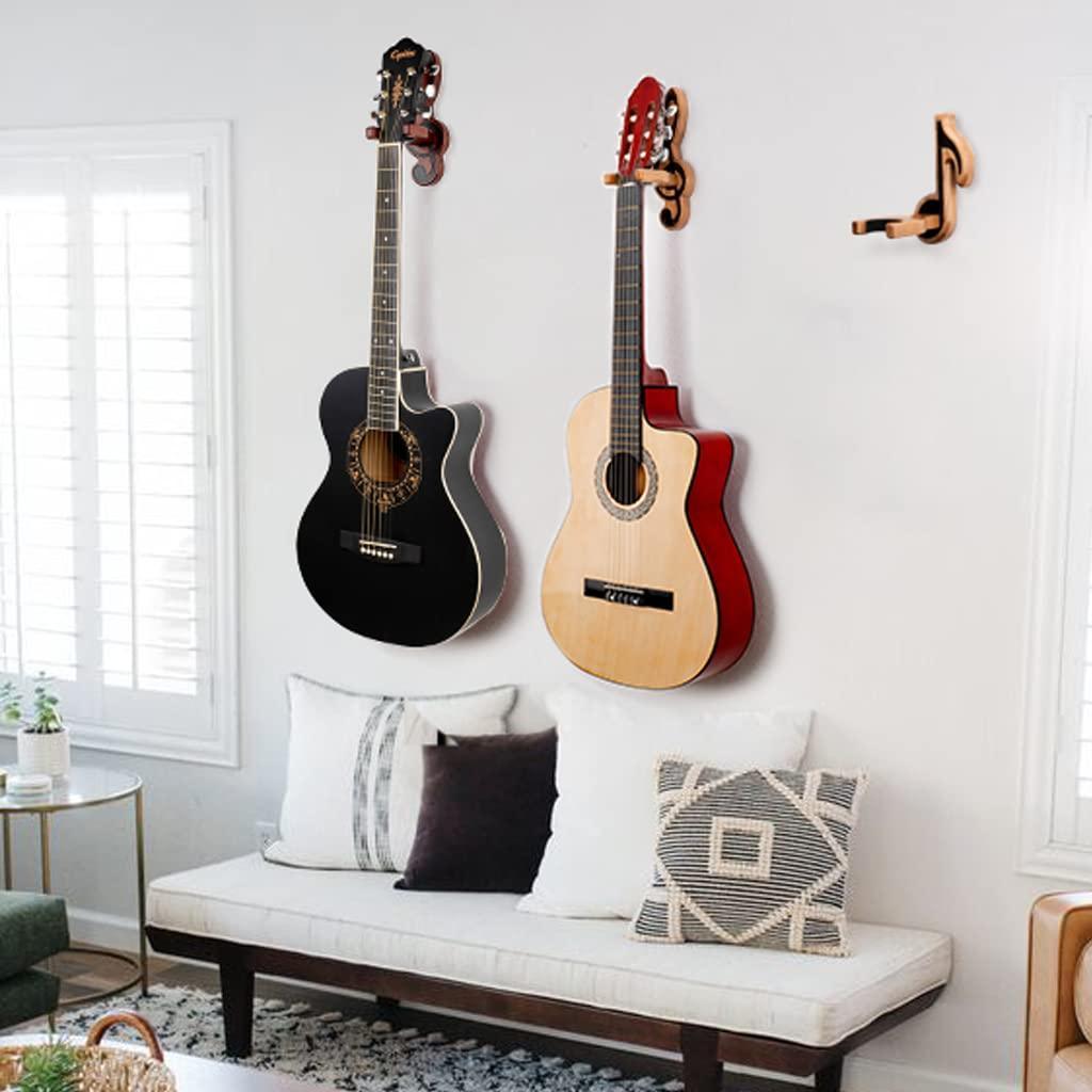 Sentence with the replaced product name: Guitar Holder Wall Mount Ash Wood Wooden Guitar Hanger Hook Stand Rack Guitar Hanger for Electric Classic Acoustic and Bass Guitar Musical Instruments Hardwood (Mahogany Musical key) with padded yoke, shown with a close-up of a guitar headstock attached to it.