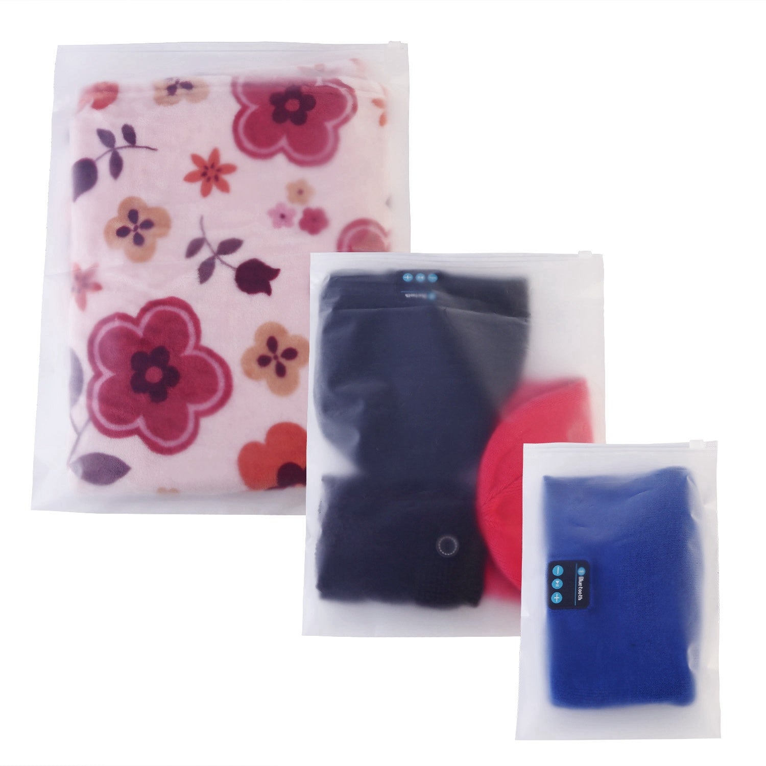 Set of four 9Pcs Clothes Storage Bags Water-Resistant Travel Luggage Organizer Clothing Packing Cubes of varying sizes with clothing items, displayed next to a folded floral blouse, all on a white background.