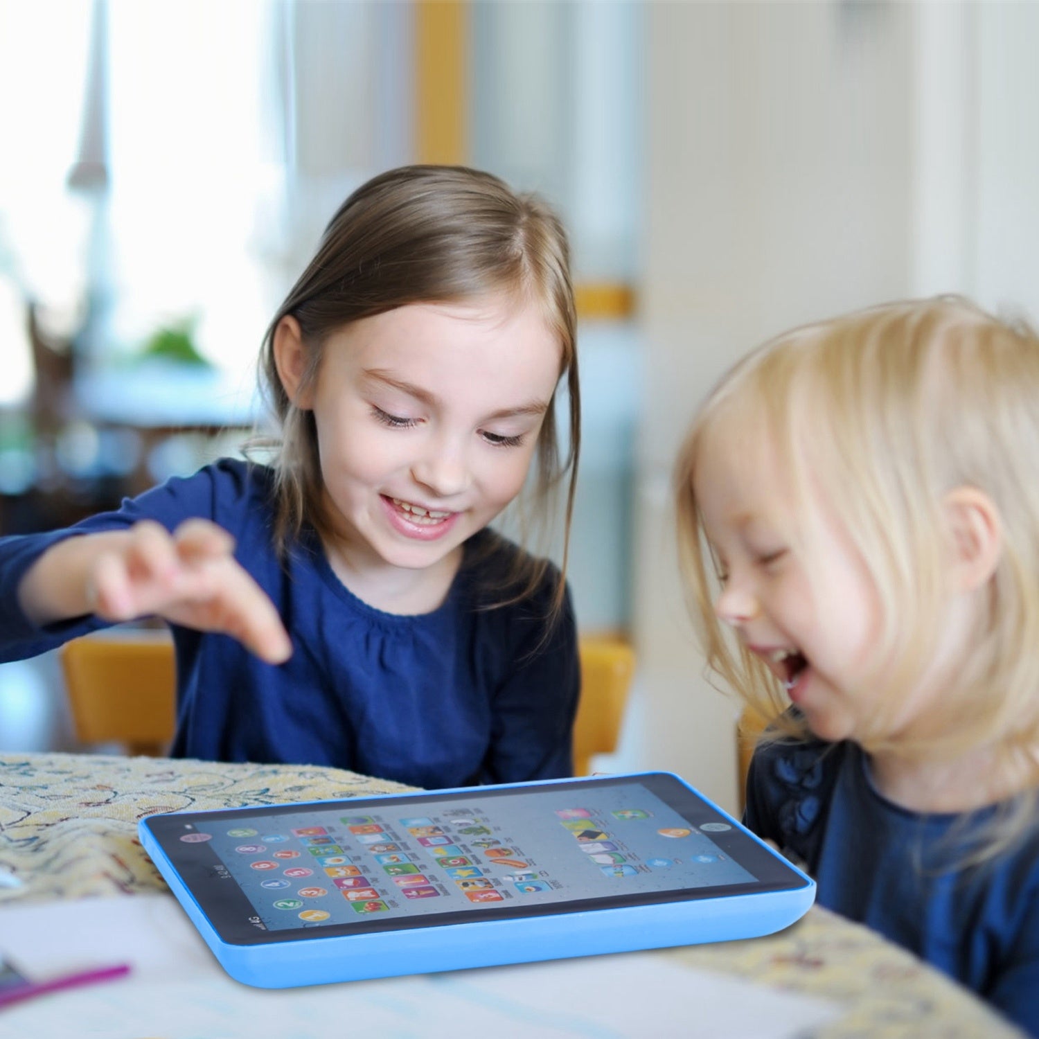 A young girl smiles while leaning on her arm next to an advertisement for a Baby Learning Tablet Educational Mini Pads Toys Touch Learn Toddler Tablet For ABC Numbers Words Gift, highlighting apps for kids aged 1-6.