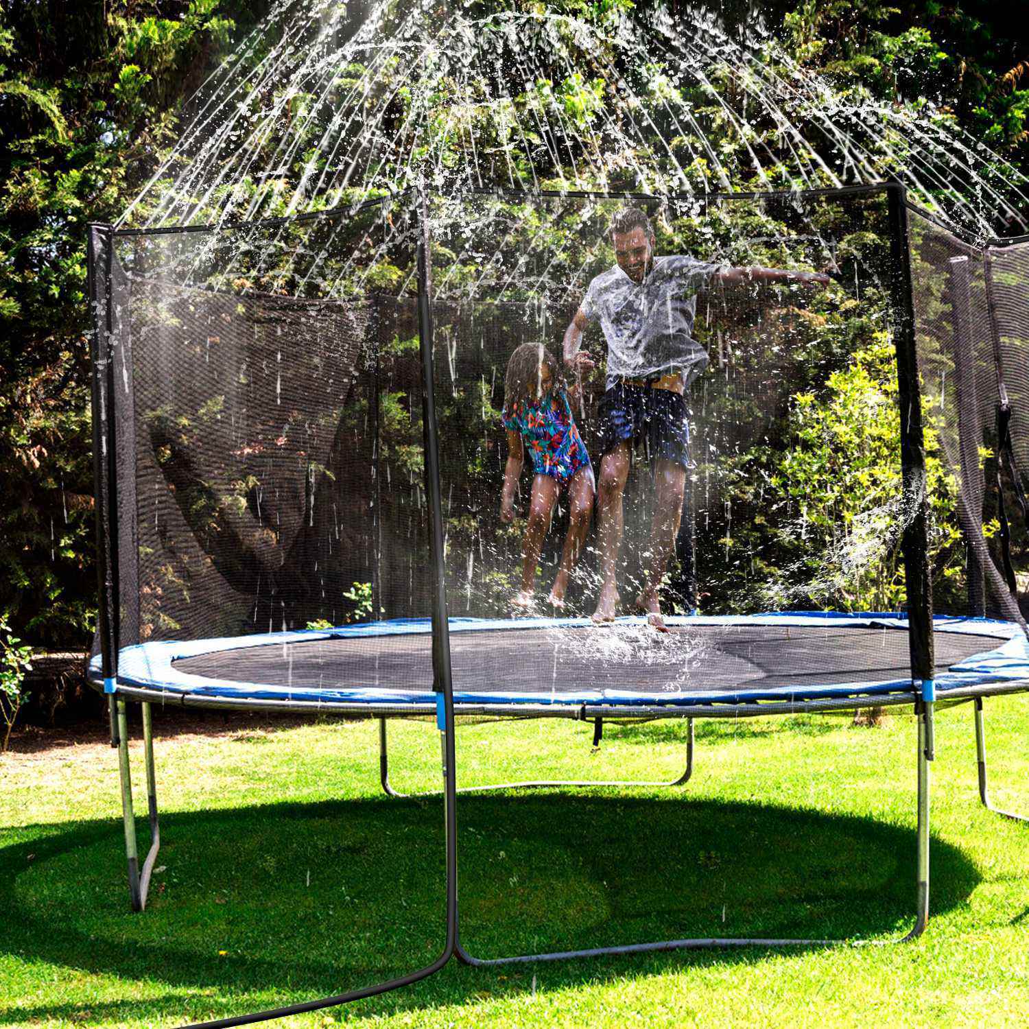 Children play on a Kids Trampoline Sprinkler under a Kids Trampoline Sprinkler, with a spray hose and attachments visible in the foreground.