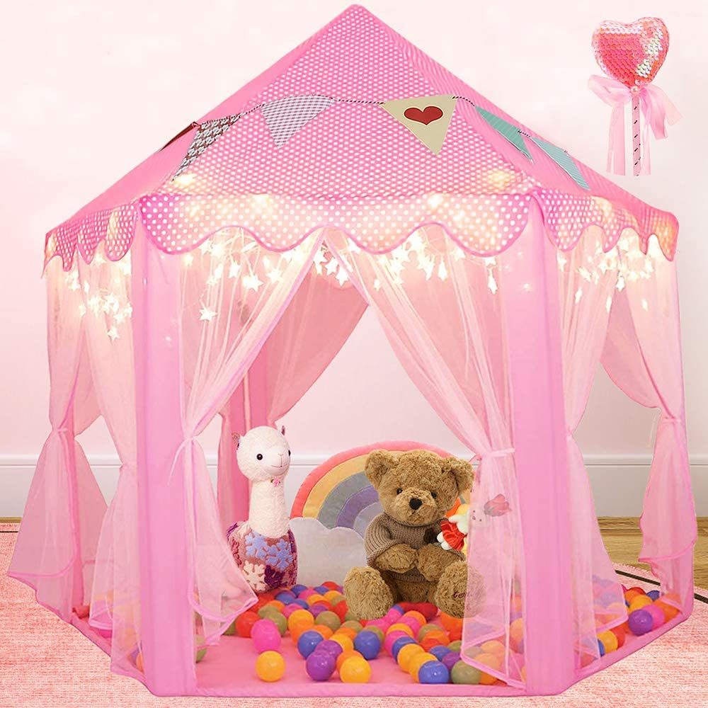 A pink Outdoor Indoor Portable Folding Princess Castle Tent Kids Children Funny Play Fairy House Kids Play Tent with its flap open, displaying several teddy bears inside, illuminated by string lights, with a star-shaped light visible at the top corner.