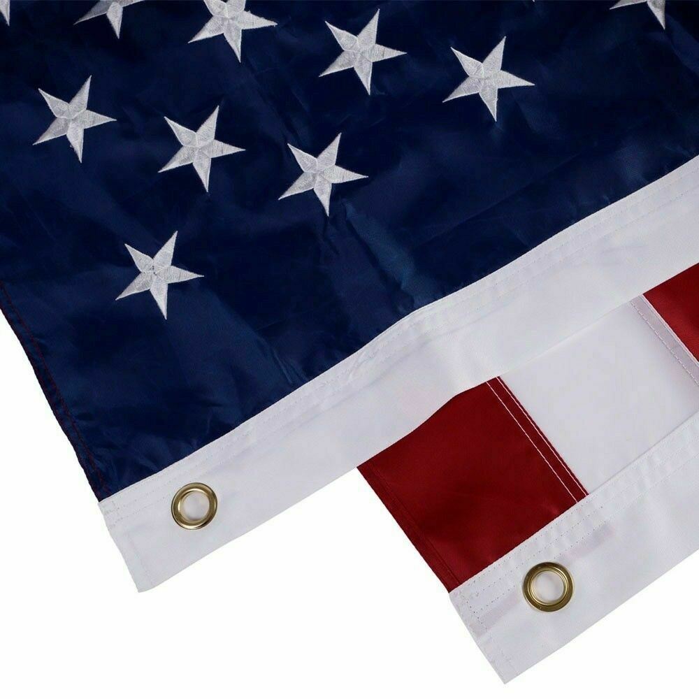 An American Flag 5x8 ft with a unique design, featuring a single large star replacing the usual field of 50 stars, against the standard thirteen red and white stripes. The star is intricately embroidered, showcasing detailed craftsmanship.