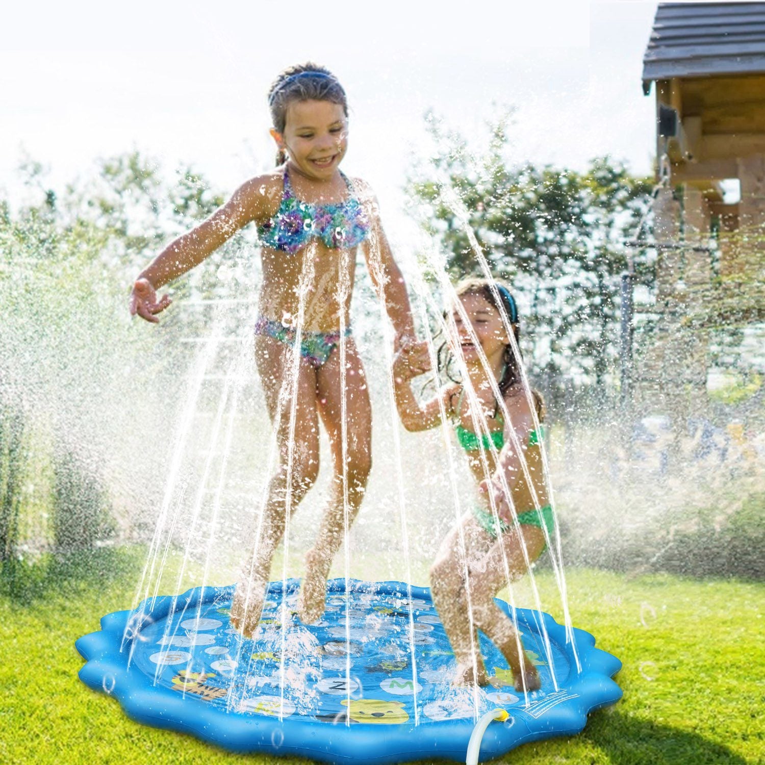 Three children playing joyfully in a Sprinkler Splash Pad For Kids 68IN Inflatable Blow Up Pool Sprinkle Play Mat Summer Outdoor Water Toys on a sandy beach, with overlay text highlighting product features.