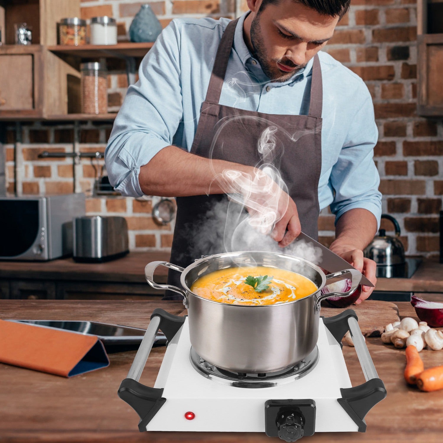 Sentence with Product Name: 1000W Electric Single Burner Portable Coil Heating Hot Plate Stove Countertop RV Hotplate with 5 Temperature Adjustments Portable Handles displayed with a man cooking on it in a kitchen setup.
