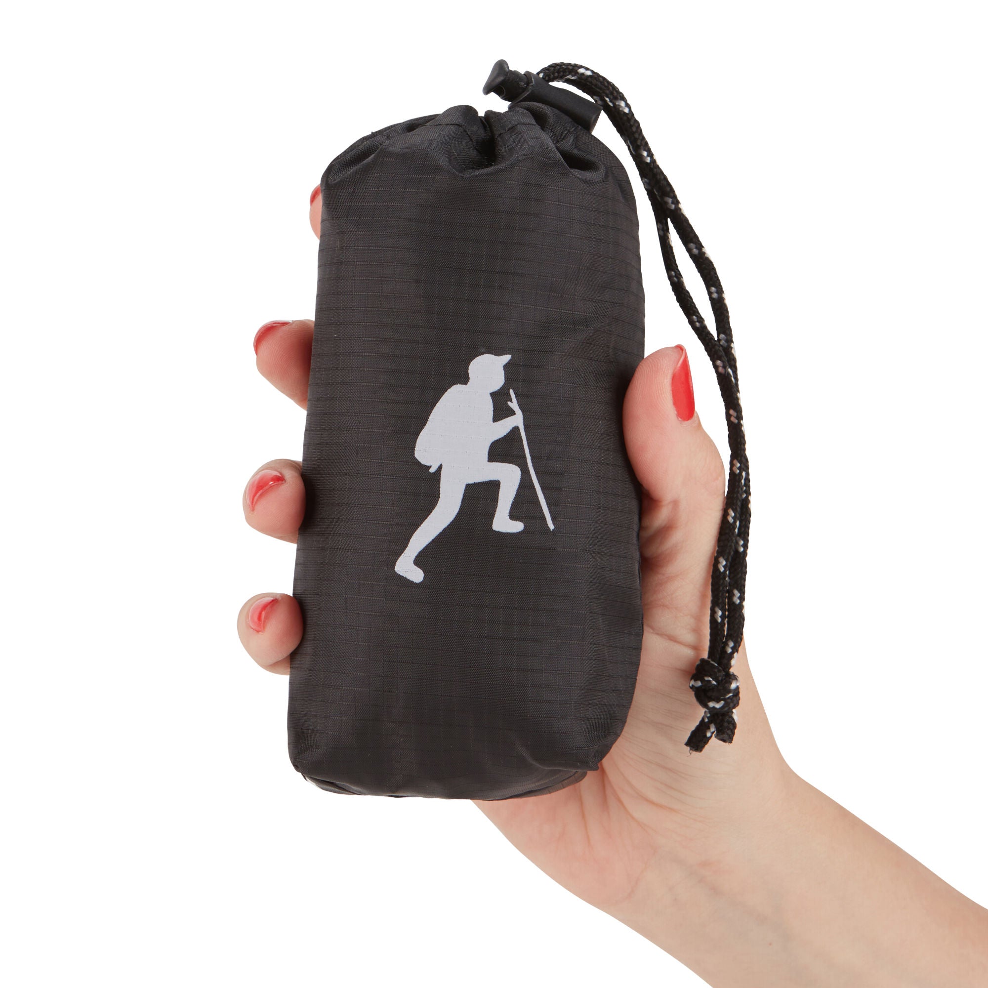 A hand holding a small, black HIKE Back- Folding Backpack with a white hiker icon printed on it, isolated against a white background.