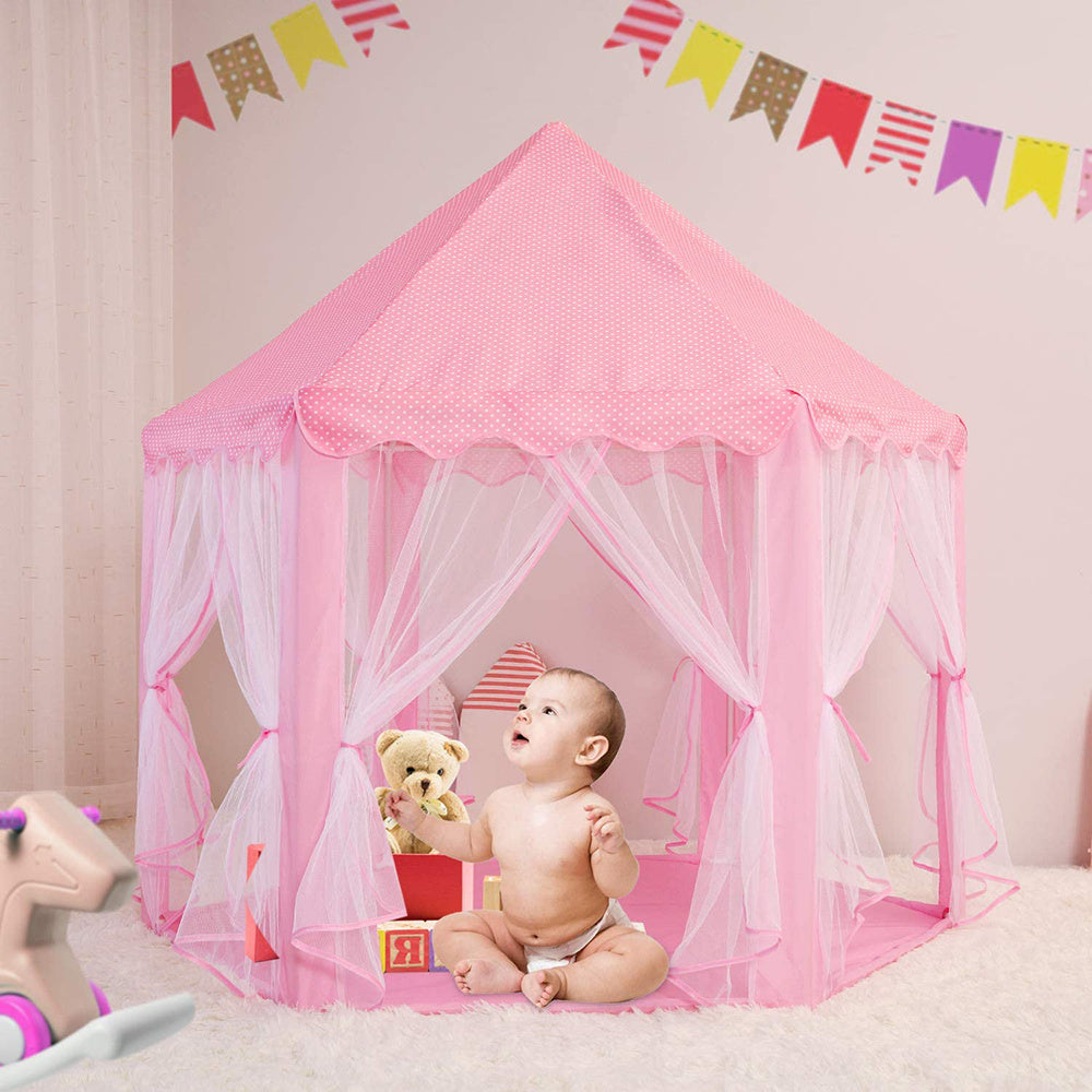 A pink Outdoor Indoor Portable Folding Princess Castle Tent Kids Children Funny Play Fairy House Kids Play Tent with its flap open, displaying several teddy bears inside, illuminated by string lights, with a star-shaped light visible at the top corner.