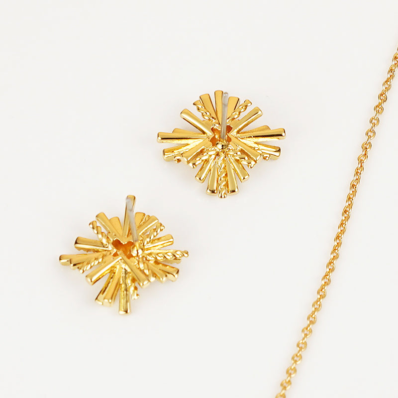 A breathtaking Starburst Gold-Plated Earrings and Necklace Set adorned with shimmering zircon accents.