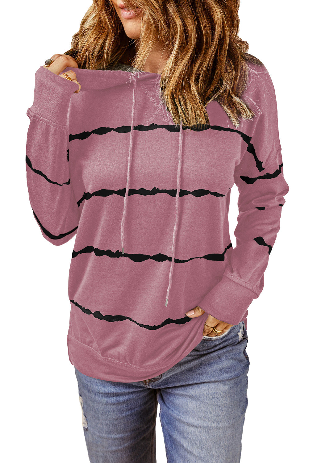 A person with wavy, light brown hair is wearing a Pink Tie-dye Striped Drawstring Hoodie with Side Split Tops and blue jeans, viewed from the back. The relaxed silhouette of the hoodie adds to its casual appeal.