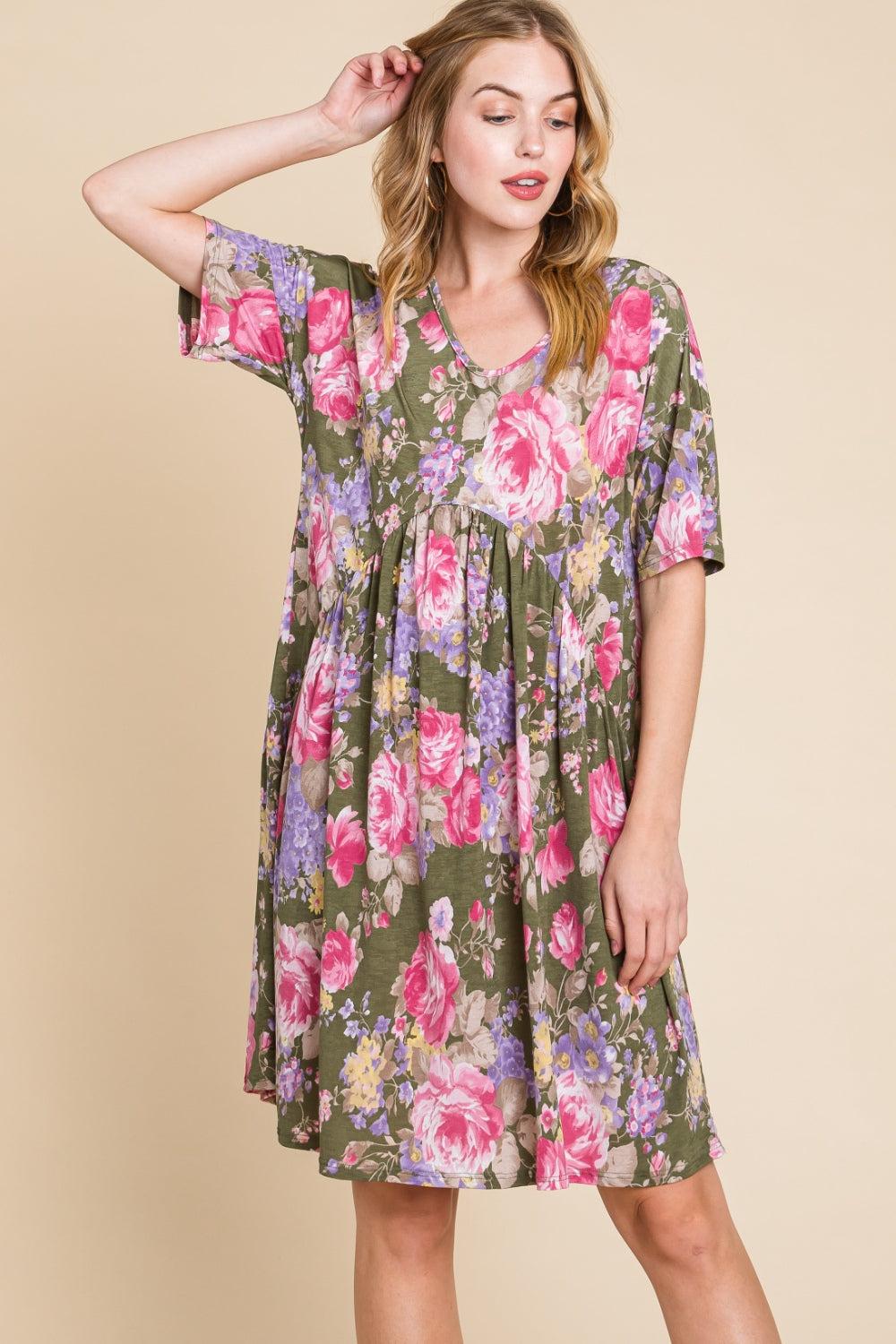 A woman in a BOMBOM Flower Print V-Neck Ruched Dress.