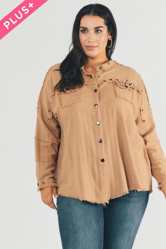 A person with dark hair wearing a Plus Distressed Hem Button Down Oversize Shirt and jeans stands against a light background, embodying casual comfort.