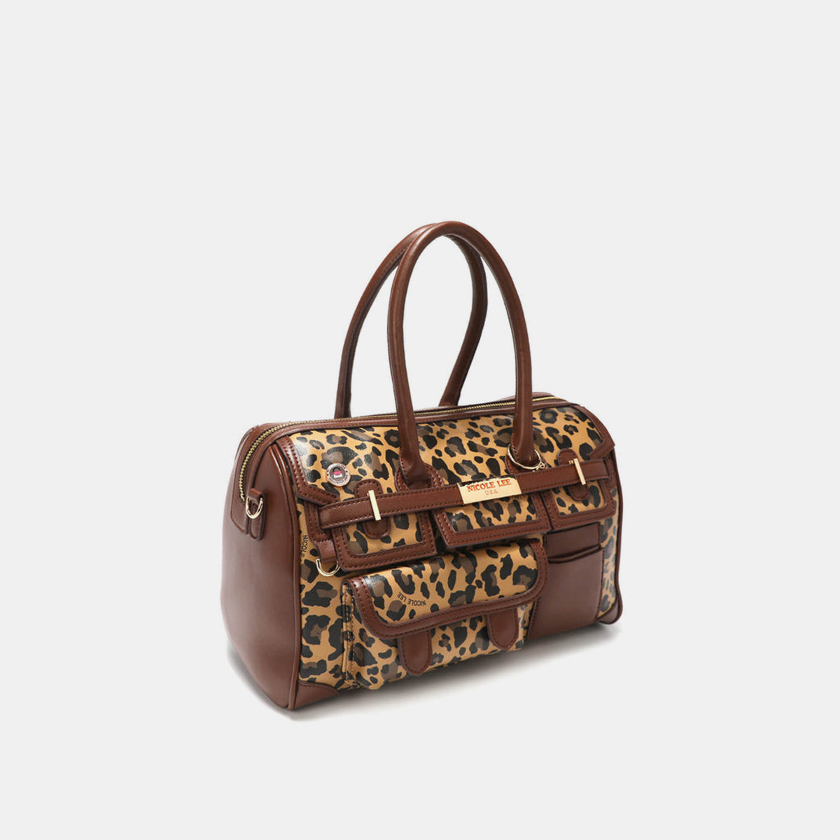 Introducing the Nicole Lee USA Leopard Boston Bag: a stylish vegan leather accessory in chic brown, boasting an eye-catching leopard print design, dual handles, multiple pockets, and adorned with a gold-tone nameplate.