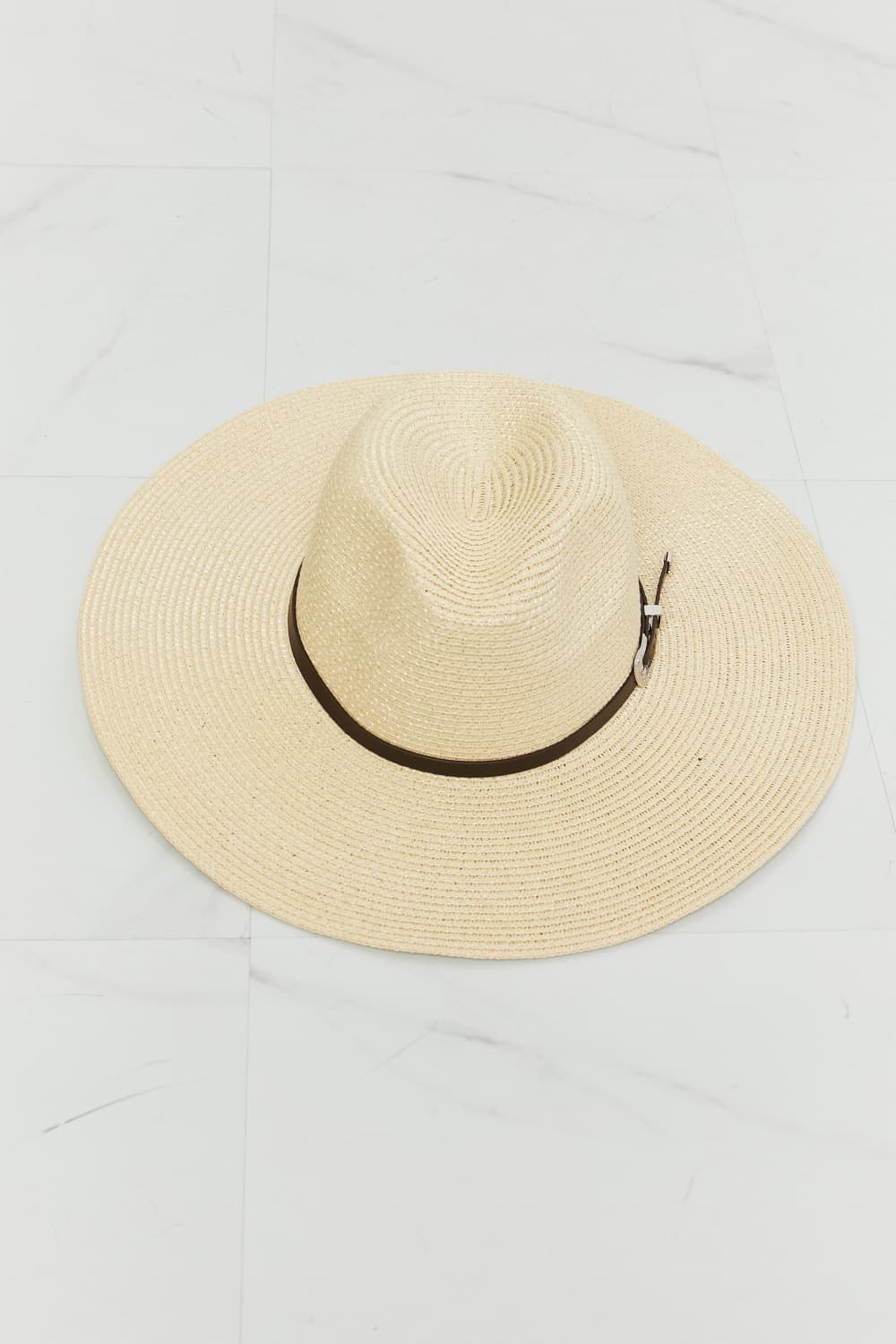 A woman wearing a light-colored tank top and a Fame Boho Summer Straw Fedora Hat with a brown band, smiling and facing slightly to the right.