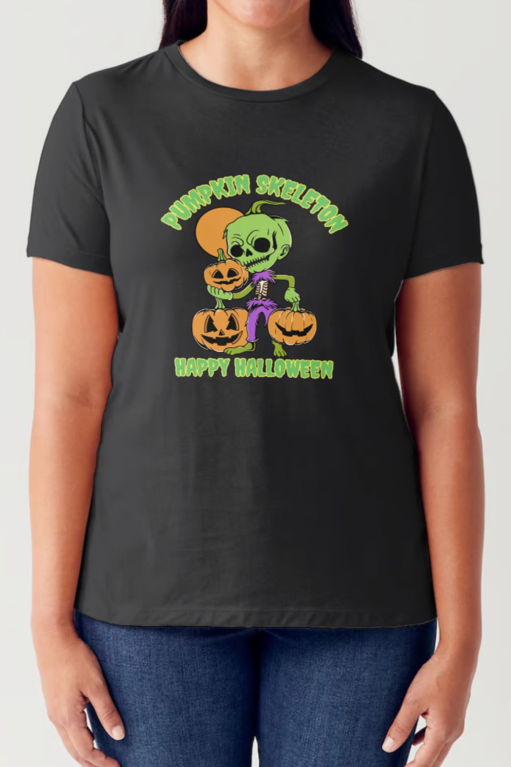 A person wearing a black Simply Love Full Size PUMPKIN SKELETON HAPPY HALLOWEEN Short Sleeve Tubular T-Shirt featuring a cartoon skeleton holding pumpkins, with "Pumpkin Skeleton" at the top and "Happy Halloween" at the bottom.