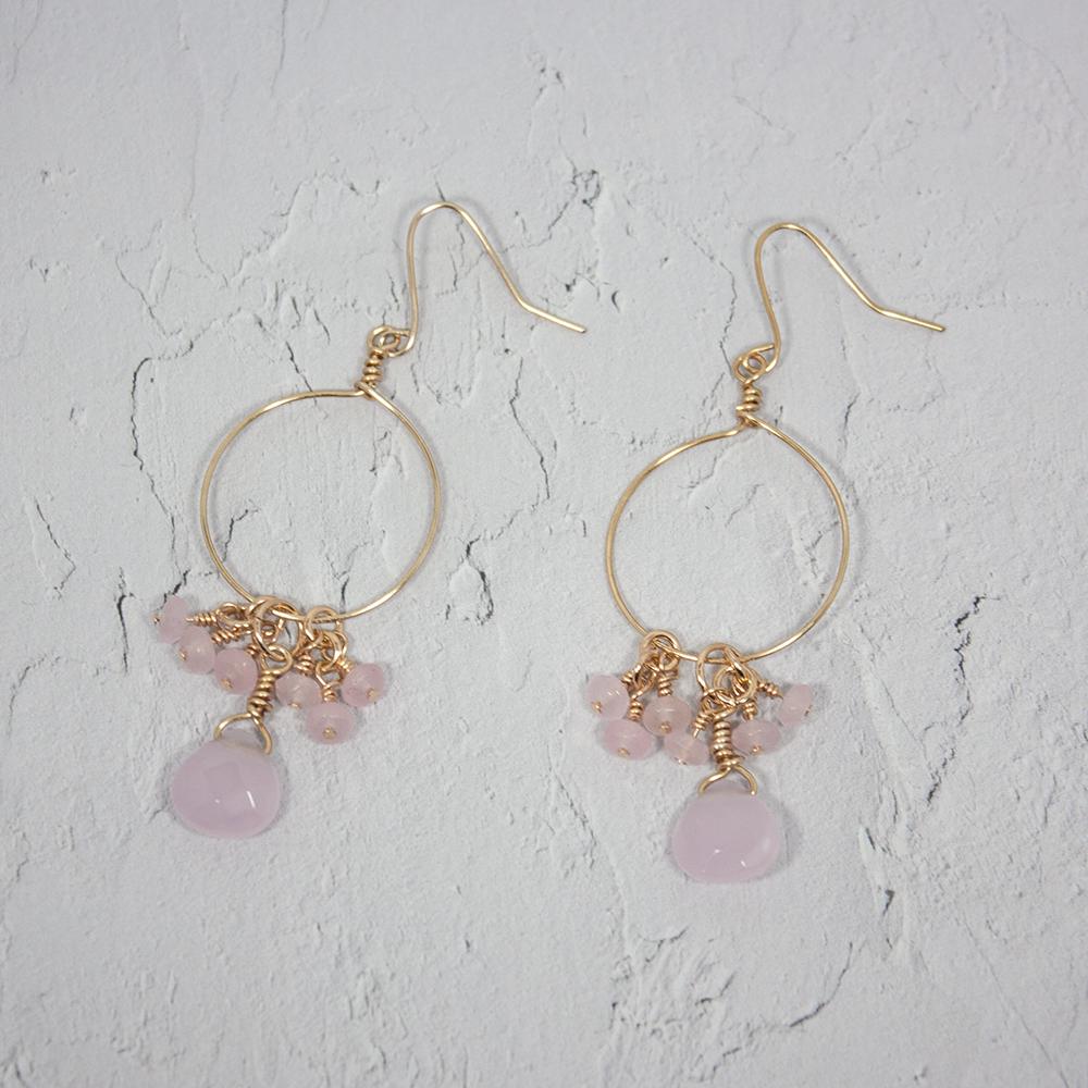 Gold hoop earrings featuring clusters of pink chalcedony and jade gemstones with teardrop pendants.