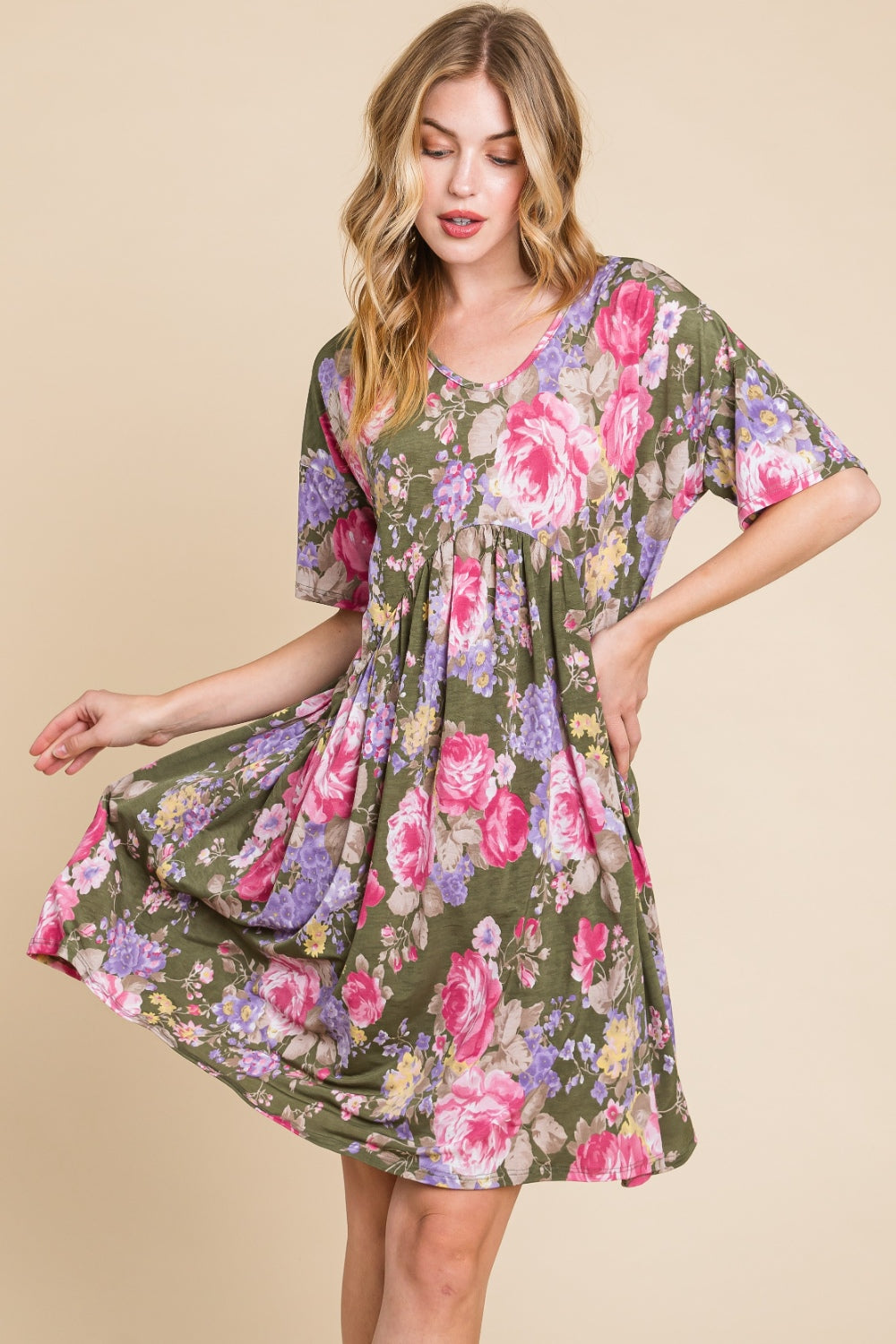 A woman in a BOMBOM Flower Print V-Neck Ruched Dress.