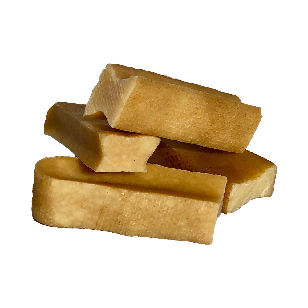 Bag of Gold Yak Chews for Small Dogs, featuring premium yak cheese blocks. The packaging emphasizes 100% natural milk sticks with no preservatives or additives, offering a gluten-free and lactose-free delight tailored for your pet!