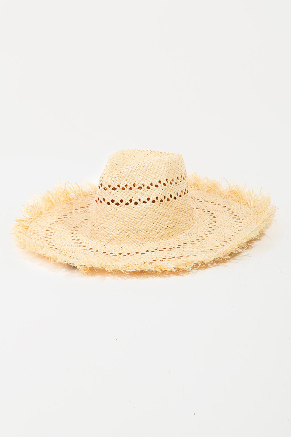 The Fame Openwork Raw Hem Weave Hat, with its wide brim and natural straw material featuring intricate openwork woven patterns, lies flat on a white background, making it the perfect chic summer accessory.