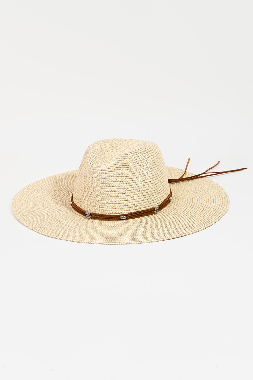 The Fame Rope Strap Wide Brim Weave Hat features a wide-brimmed straw design with a brown leather band and decorative silver accents, perfect for sun protection at the beach.