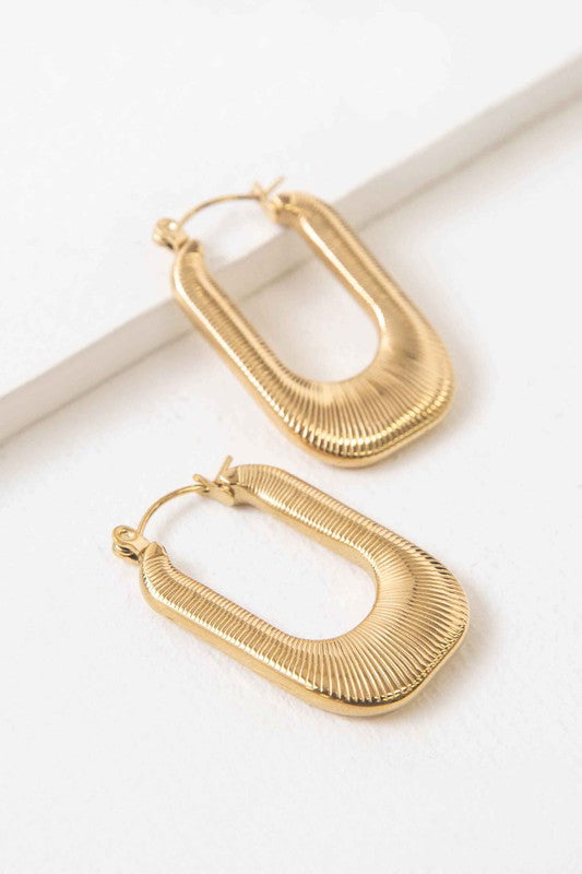 Nomad Hoop Earrings with a grooved texture on a white background.