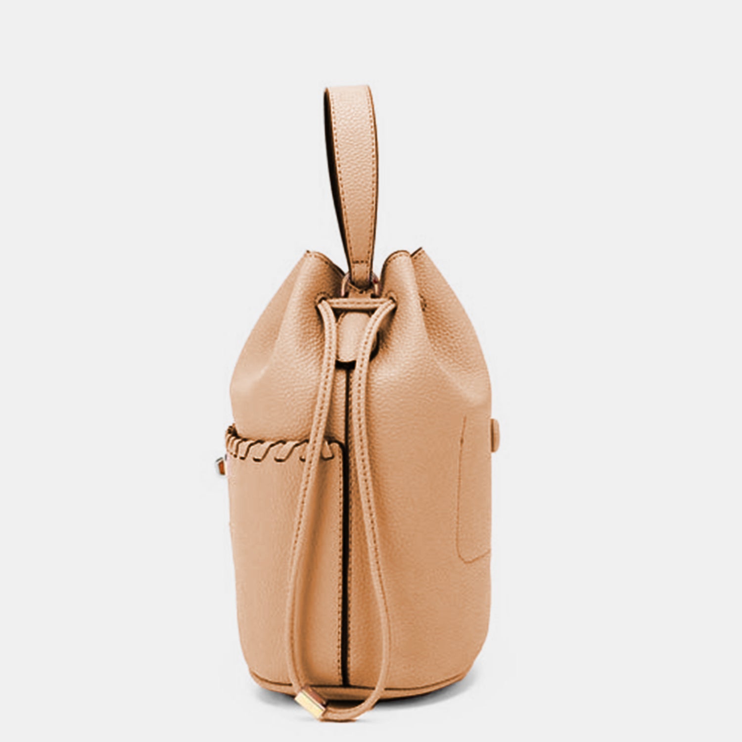 Nicole Lee USA Drawstring Bucket Bag made from eco-leather with an adjustable black strap, featuring a cinched top and gold-toned hardware, along with a silver clasp at the front.