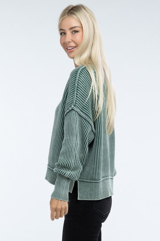 Person wearing a green Washed Side Slit Oversized Cropped Sweater with drop shoulders and black pants, standing against a plain background.