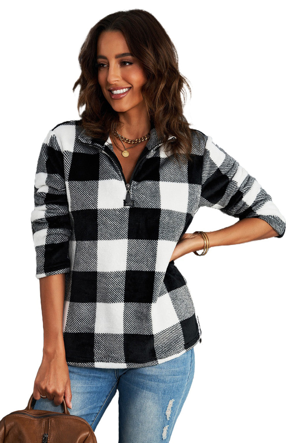 A woman with wavy hair is wearing a cozy Black Plaid Print 1/4 Zip Turn-down Collar Sweatshirt and blue jeans, standing with her back to the camera against a textured gray background.