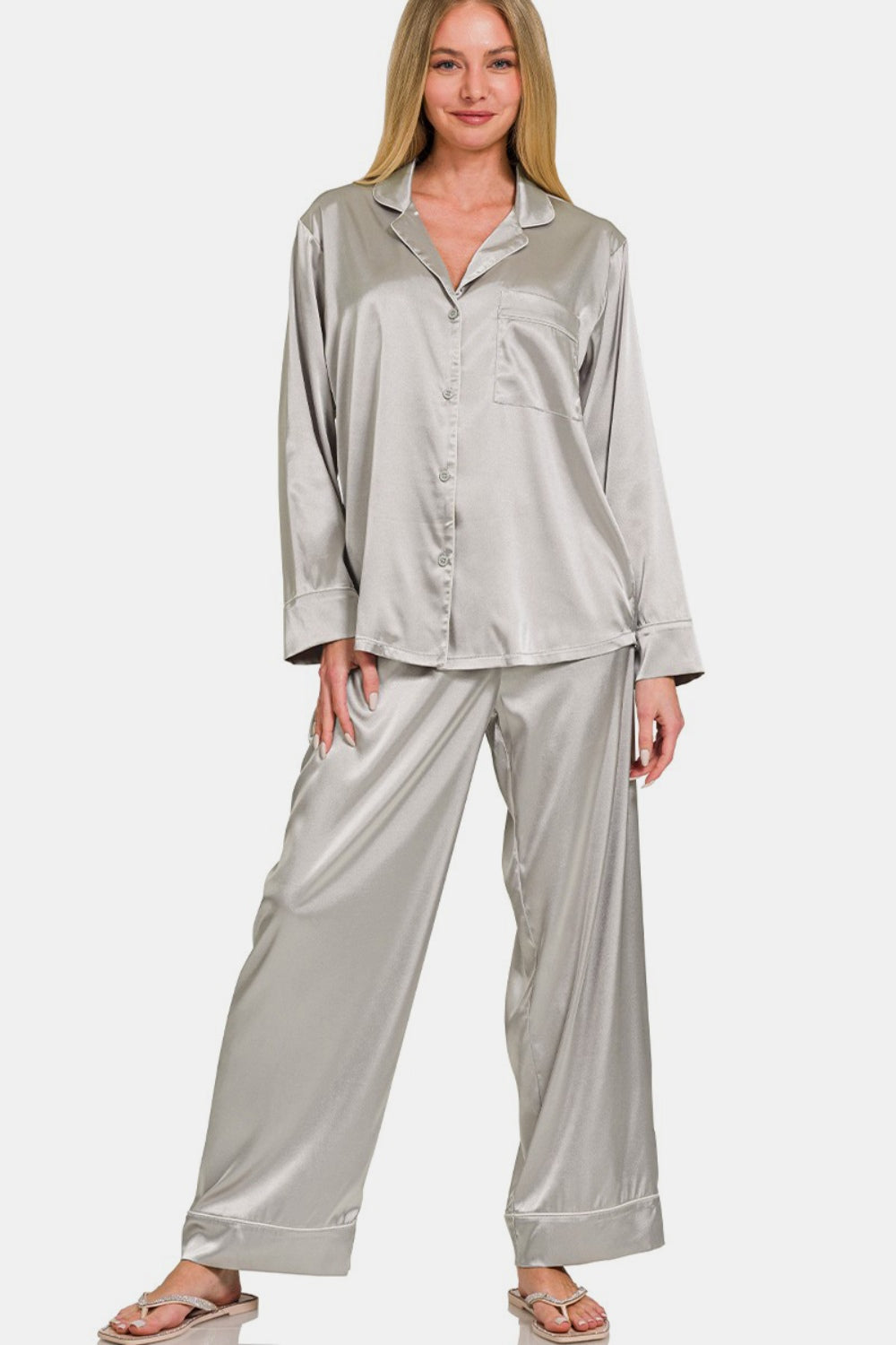 A person wearing the Zenana Satin Long Sleeve Shirt and Pants Pajama Set stands against a plain background.