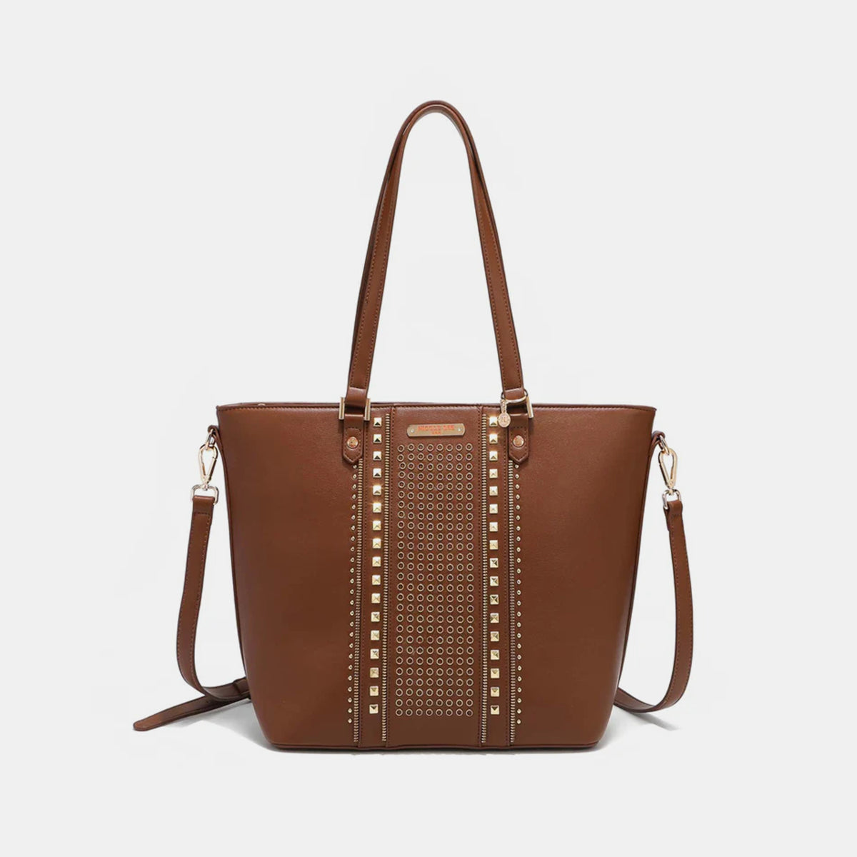 The Nicole Lee USA Studded Decor Tote Bag boasts a trendy appeal with its vegan leather material, highlighted by silver studs and dual shoulder straps, showcased against a white background.