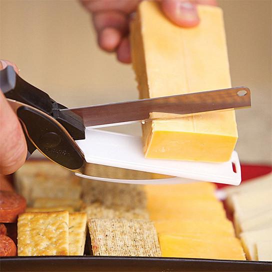A person using Master Chop The Quick Easy Food Prep Dicer And Chopper in a red pot.