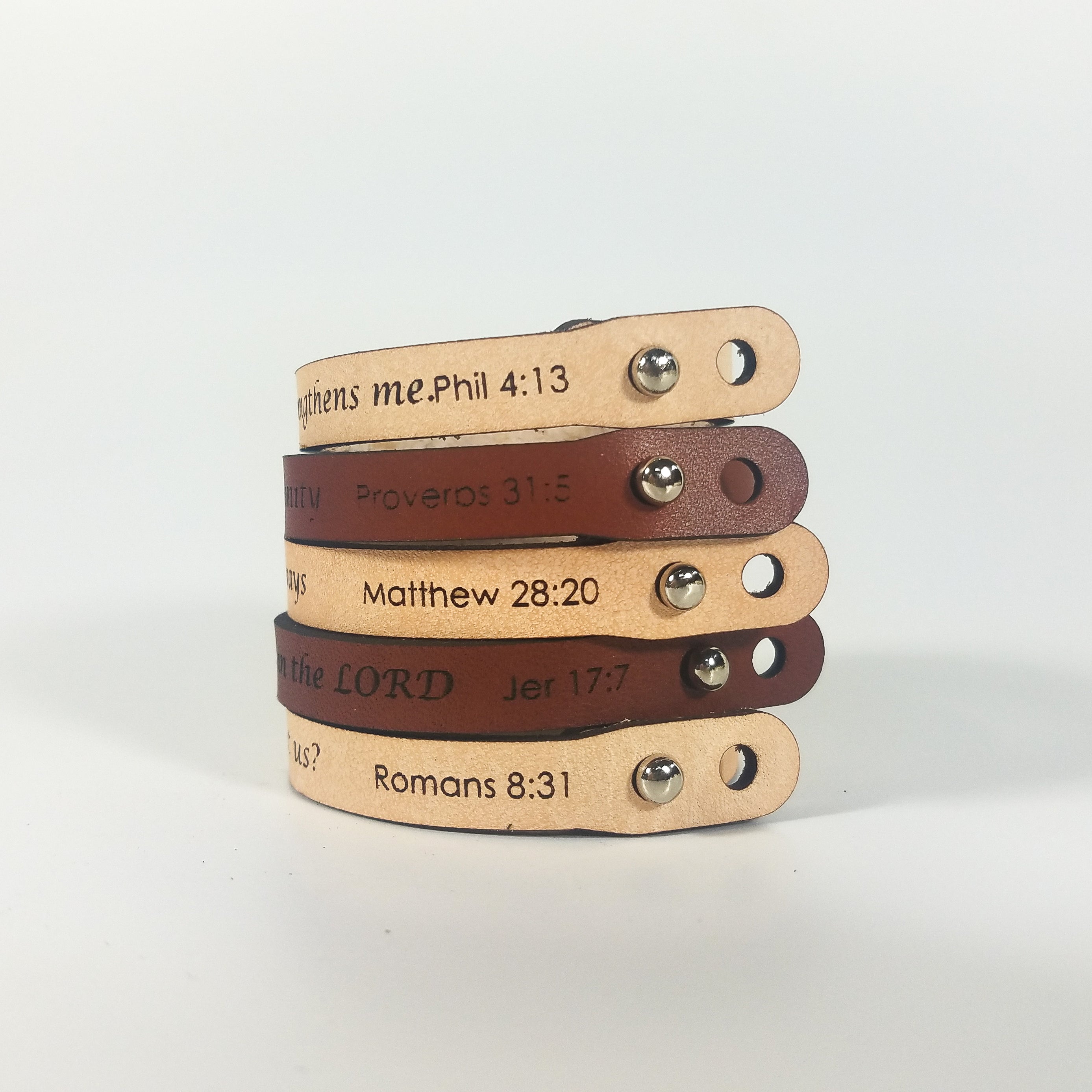 The Spiritual Quote Bracelet made of genuine leather features an adjustable button closure and is inscribed with the message: "If God is for us, who can be against us.